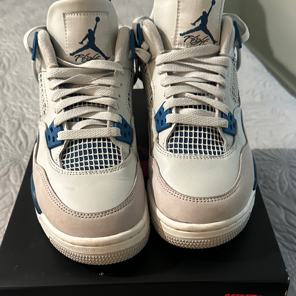 Air Jordan 4 Retro Sneakers in White and Blue